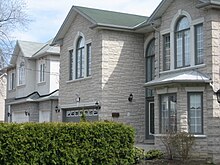 Large two-storey luxury homes emerged in the neighbourhood in the early-1990s, replacing many of the older houses. Willowdale homes.JPG