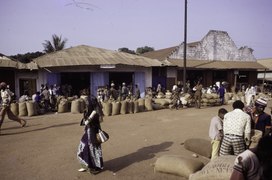 People at the shop of Hidar Hammam on the main road, Ganta (Gompa City), Nimba county, Liberia, 1976.