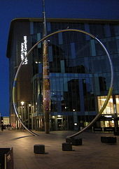 Alliance by night, showing the pinpricks of light on the arrow, as well as the partial glow of the hoop.