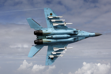 Bangladesh Air Force MiG-29B showing its full underbelly. Note the six underwing pylons carrying R-27 and R-73 air-to-air missiles. The centerline fuel tank is seen with an APU exhaust duct.