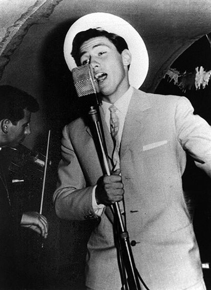 Berlusconi singing on a cruise ship in the 1960s