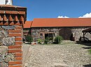 Courtyard with residential house and farm buildings