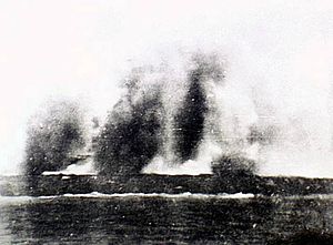 Bomb spray obscures the British cruiser HMS Exeter.jpg