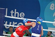 Deutsch: Boxen bei den Olympischen Jugendspielen 2018 Tag 12, 18. Oktober 2018 - Finale Fliegengewicht Mädchen – Martina La Piana (Italien, blau) schlägt Adijat Gbadamosi (Nigeria, rot) 5-0; Ringrichter ist James Beckles (Trinidad und Tobago). English: Boxing at the 2018 Summer Youth Olympics on 18 October 2018 – Girl's flyweight Gold Medal Bout - Martina La Piana (Italy, blue) beats Adijat Gbadamosi (Nigeria, red) 5-0; Referee is James Beckles (Trinidad and Tobago). Español: Boxeo en los Juegos Olímpicos Juveniles de Verano de 2018 en 18 de octubre de 2018 - Combate a medalla de oro de peso mosca para mujeres: Martina La Piana (Italia, azul) le gana a Adijat Gbadamosi (Nigeria, roja) 5-0; El árbitro es James Beckles (Trinidad y Tobago).