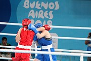 Deutsch: Boxen bei den Olympischen Jugendspielen 2018 Tag 12, 18. Oktober 2018 - Finale Leichtgewicht Mädchen – Oriana Saputo (Argentinien, blau) schlägt Emma Lawson (Australien, rot) 5-0; Ringrichter ist José Romero (Spanien). English: Boxing at the 2018 Summer Youth Olympics on 18 October 2018 – Girls' lightweight Bronze Medal Bout – Oriana Saputo (Argentina, blue) wins over Emma Lawson (Australie, red) 5-0; Referee is José Romero (Spain). Español: Boxeo en los Juegos Olímpicos Juveniles de Verano de 2018 en 18 de octubre de 2018 - Combate de medalla de bronce de las niñas: Oriana Saputo (Argentina, azul) gana a Emma Lawson (Australie, roja) 5-0; Árbitro es José Romero (España).