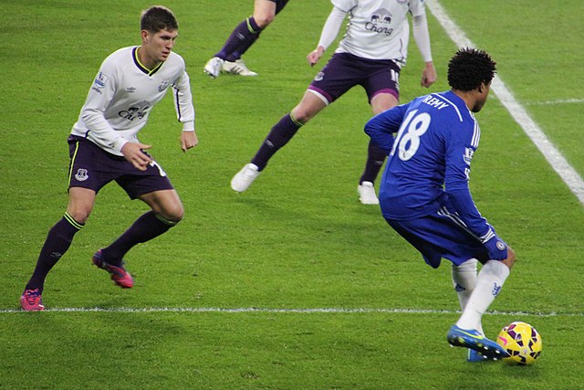 Stones (left) playing for Everton in 2015