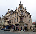 Residential and commercial building in corner location and half-open development, plus parts of the shop fittings