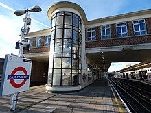 View of platforms with glazed stairwells and offices spanning the tracks East Finchley Station (2) 06.jpg