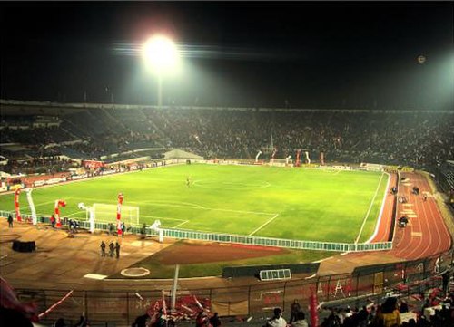 Estadio Nacional at night.