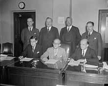 Federal Communications Commission seen in Washington, D.C., in 1937. Seated (l-r) Eugene Octave Sykes, Frank R. McNinch, Chairman Paul Atlee Walker, Standing (l-r) T.A.M. Craven, Thad H. Brown, Norman S. Case, and George Henry Payne. Federal Communications Commission 1937 10 6.jpg