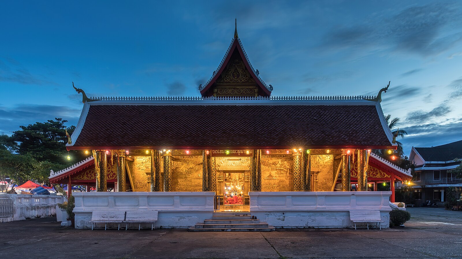 Front view of Wat Mai Suwannaphumaham Buddhist temple at blue hour in Luang Prabang Laos