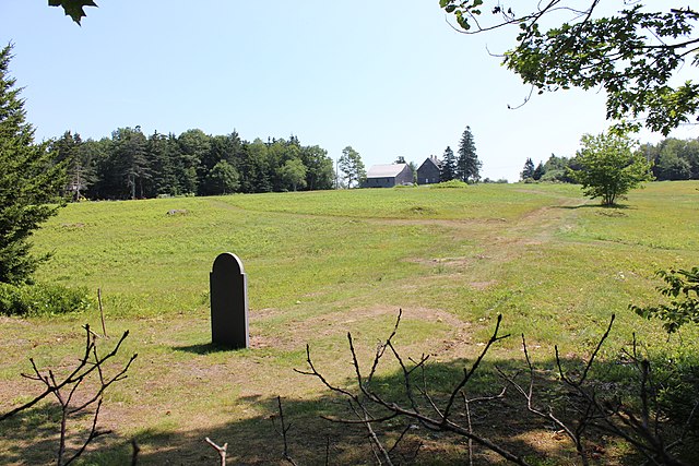 Grave of Andrew Wyeth, with the Olson House in the background, Cushing, Maine