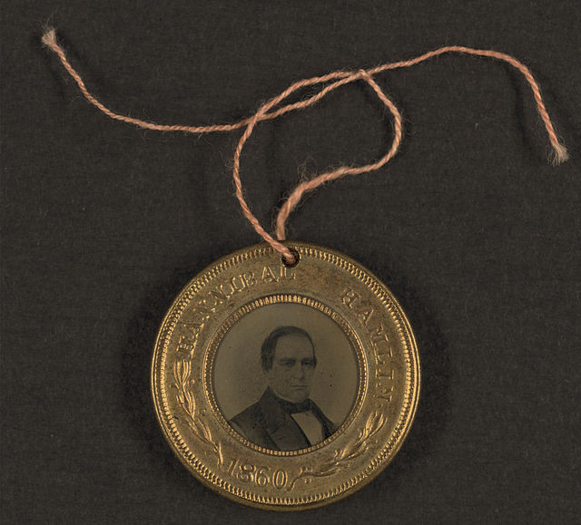 1860 election campaign button for Abraham Lincoln and Hannibal Hamlin. The other side of the button has Lincoln's portrait.