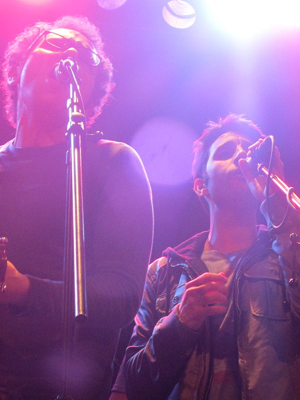 The personal lyrics, written by the band members (pictured), were highly praised by critics.
