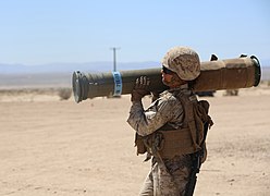 A US Marine carrying a BTM-71E practice round.