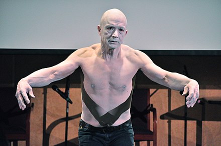 Jay Hirabayashi performs a butoh dance piece in memory of his parents, Gordon and Esther Hirabayashi, at a Day of Remembrance event in Seattle, Washington, February 22, 2014.