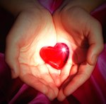 A heart cupped in two hands.