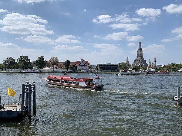 Chao Phraya Express Boat on the Chao Phraya, Wat Arun is visible in the background