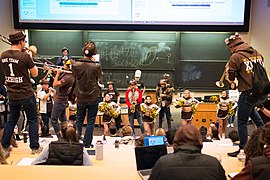 The band “flames” a classroom in Neville Hall as part of the annual “Eco-Flame” tradition.