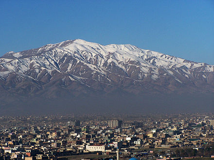 Kabul, situated 5,900 feet (1,800 m) above sea level in a narrow valley, wedged between the Hindu Kush mountains