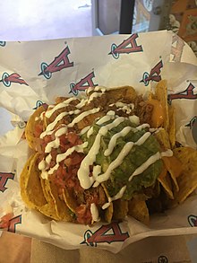 Nachos with cheese, chicken, pico de gallo, sour cream, and guacamole NachosAtAngelStadium.jpg