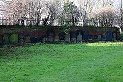 Gravestones lined up on the walls of St. Peter's Park on Great Union Street in Kingston upon Hull, the site of the former St. Peter's Church which was destroyed by bombing action during the Second World War in 1941.