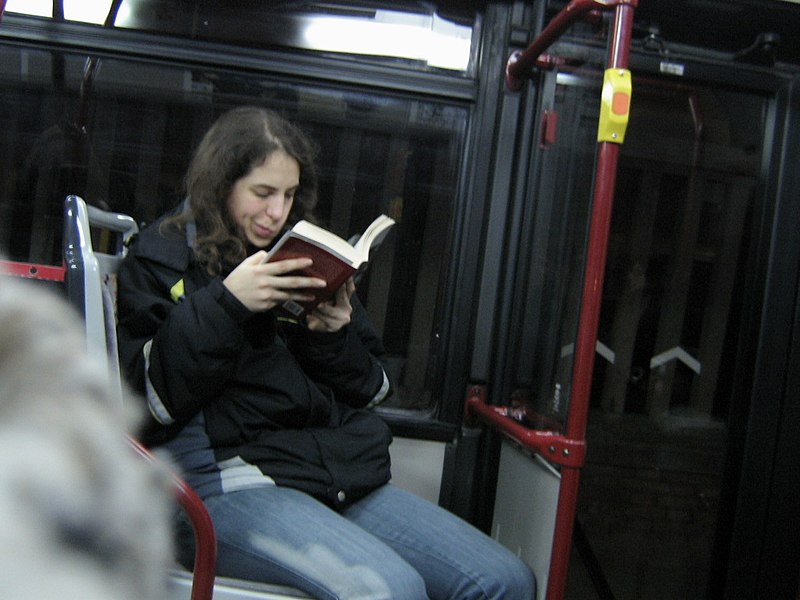 File:On Bus Reading.jpg