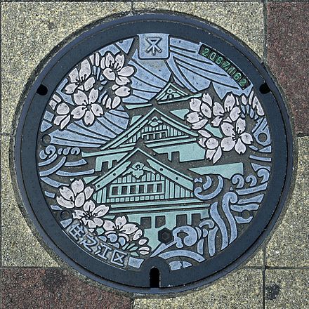 Painted manhole cover in Osaka, Japan