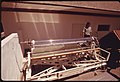 Prototype of a linear parabolic reflector used to gather the sun's energy and heat fluid in the center pipe to several hundred degrees F..., 04-1974 (7066003241).jpg