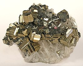 Pyrite from the Sweet Home Mine, with golden striated cubes intergrown with minor tetrahedrite, on a bed of transparent quartz needles