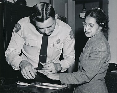 Rosa Parks being fingerprinted by Deputy Sheriff D.H. Lackey after being arrested for boycotting public transportation