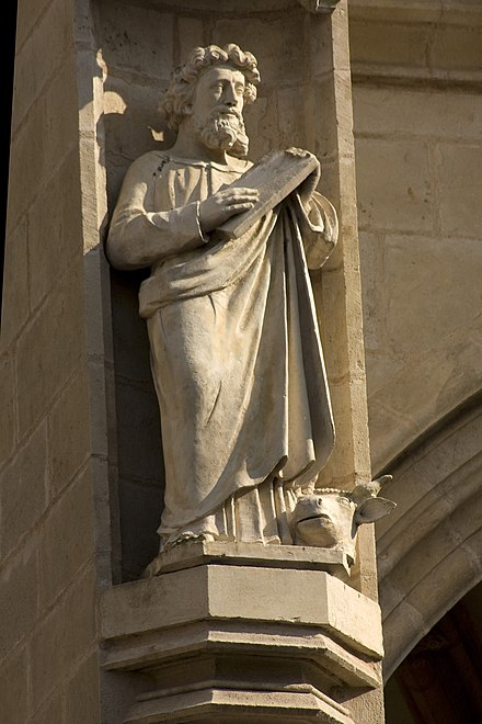 St. Luke, as depicted on the façade of the Collégiale Notre-Dame