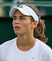 Stephanie Vogt competing in the first round of the 2015 Wimbledon Qualifying Tournament at the Bank of England Sports Grounds in Roehampton, England. The winners of three rounds of competition qualify for the main draw of Wimbledon the following week.