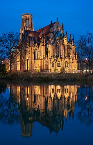 The Johanneskirche (Saint John’s church) in Stuttgart, Germany, seen via the Feuersee at blue hour
