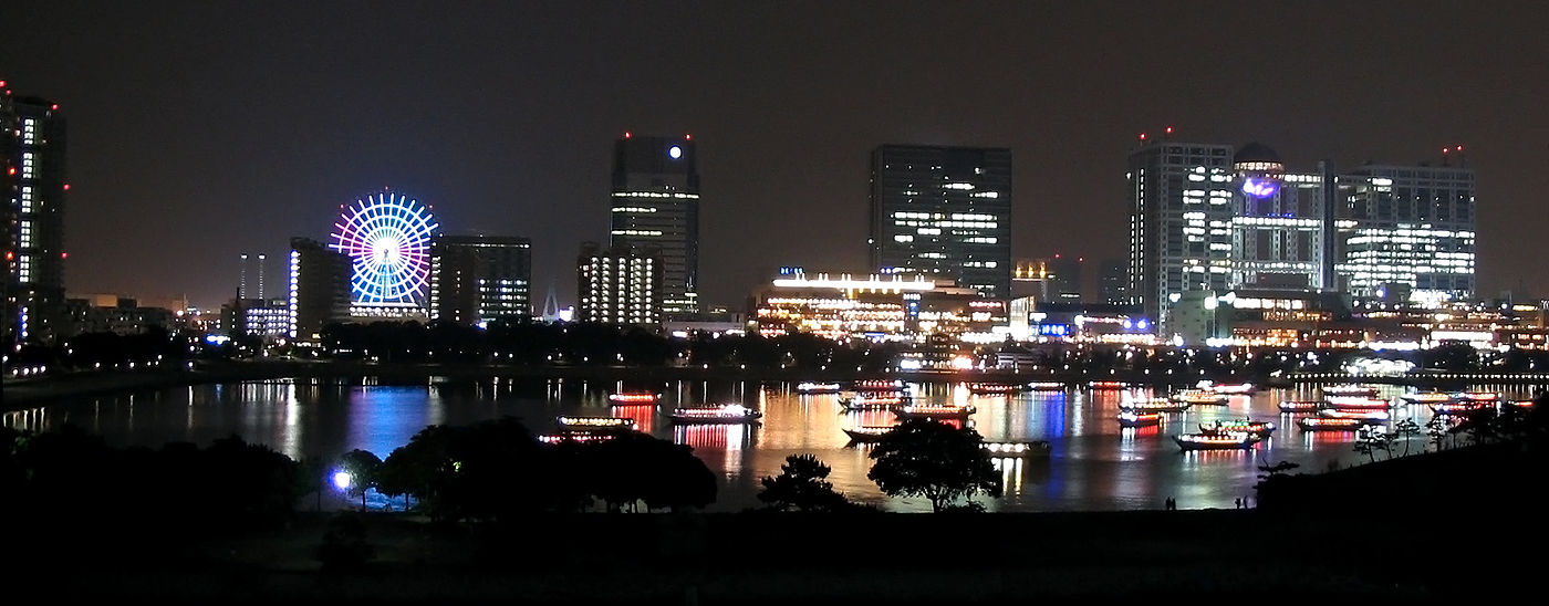 Odaiba at night, with yakatabune boats in the bay foreground
