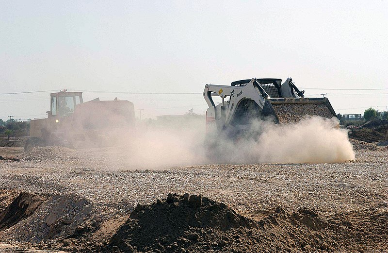 File:US Air Force (USAF) Airmen assigned to the 438th Expeditionary Civil Engineering Flight (ECEF), operate heavy equipment in preparation for the installation of new "Cadillac" latrine - DPLA - 6a04a50ae3ccfe42034d24e4c0886d01.jpeg
