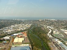 The Umgeni River estuary (Blue Lagoon) and lower reaches flanked by Umgeni Business Park, Umgeni Park, Morningside, Moses Mabhida Stadium, Umgeni River Bird Park and Burman Bush Umgeni river mouth, 21-Aug-2011.jpg