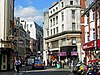 The heart of Soho - this is the intersection of Wardour Street and Old Compton Street - a gay bar, Ann Summers sex shop, a chic cafe and a shoe repairer