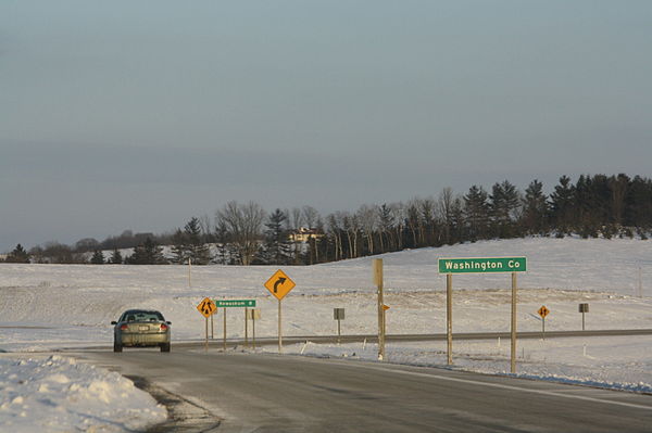 Sign on WIS 28 marking the county boundary