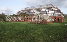 The west side of Springburn Winter Gardens in 2017, showing the two wing greenhouses. Similar structures on the east side of the building were demolished in the mid-1980s. Winter Gardens, Springburn Park (geograph 5307467).jpg