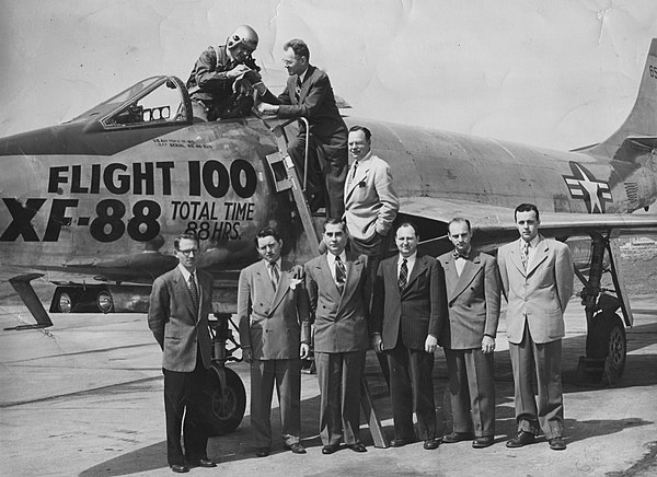 The engineering team stands after Flight 100.