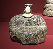 Female figurine of the "Bactrian princess" type; between 3rd millennium and 2nd millennium BC; grey chlorite (dress and headdresses) and calcite (face); Barbier-Mueller Museum