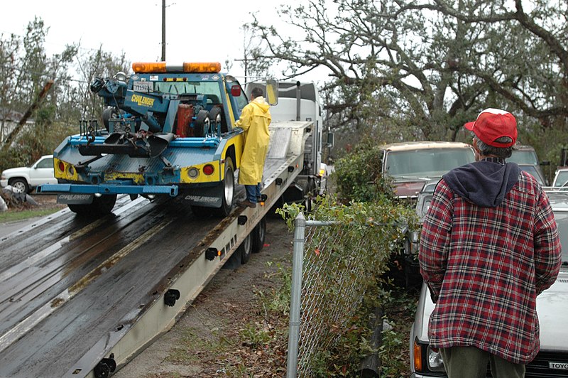 File:(Hurricane Katrina) Pass Christian, Miss., January 17, 2006 -- Wrecker driver Johnny Hogan looks on as a used wrecker donated by the California Tow Truck Driver's Association is del - DPLA - c2fbea03f23acde3e6695cca63f05332.jpg