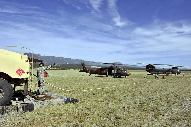 File:A U.S. Army CH-47 Chinook helicopter, right, with the 4th Combat Aviation Brigade and a UH-60 Black Hawk helicopter with the Colorado Army National Guard take on fuel before fighting wildfires near Colorado 130612-F-JM997-777.jpg