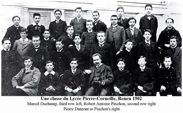 A class at the Lycée Pierre-Corneille, 1902. Artists Robert Antoine Pinchon (second row, right) and Marcel Duchamp (third row, left, out of focus). On