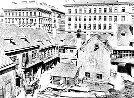 Um 1900 „Alt-Wien“ muss weichen. Zinshäuser (hinten) ersetzen die alten Vorstädte. Alsergrund (IX)