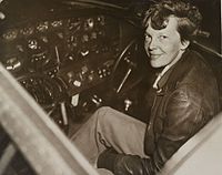 Amelia Earhart in the cockpit of her airplane in 1937.