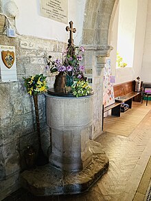 The baptismal font is 12th century Norman Baptismal font St Helen North Thoresby.jpg