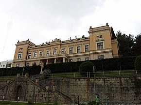 Low-angle image of a dark-yellow building