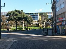 The vicinity of the murder. Horseshoe Common is the green space on the left, with Old Christchurch Road leading into the distance. The Subway where Roberts was murdered is further around the corner. Bournemouth, shared space scheme at Horseshoe Common - geograph.org.uk - 4838047.jpg